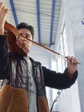 Fernando playing the violin